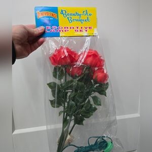 NIP 3 sets of rose plug in flower lights. 5 flowers per set. So 15 altogether.